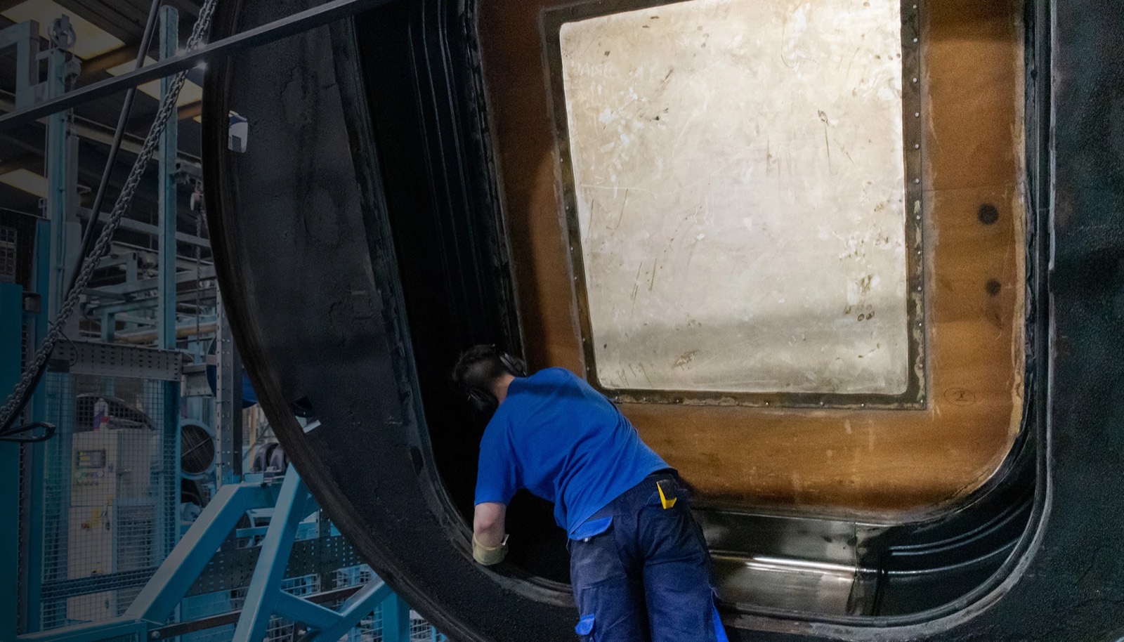 Engineer working inside a rotational mould