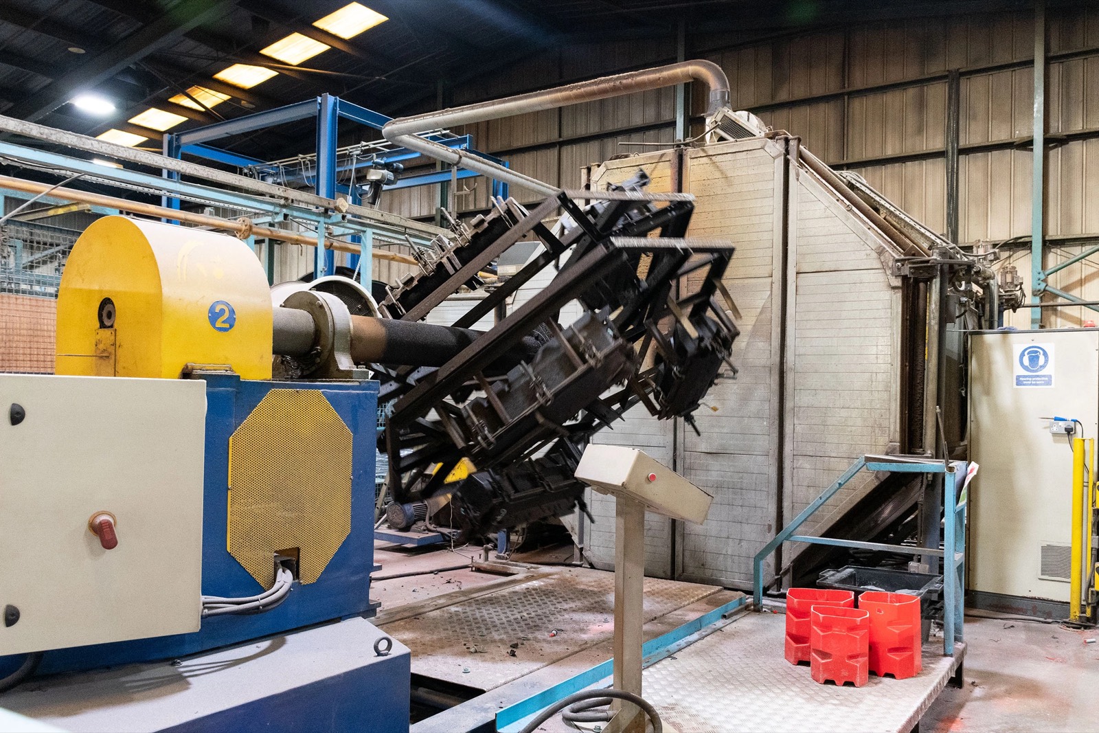 Rotomoulding arm mid-cycle on the factory floor
